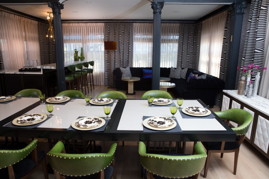 green dining chairs, black couch, home bar 